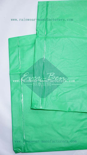Green plastic hooded rain mac sleeves